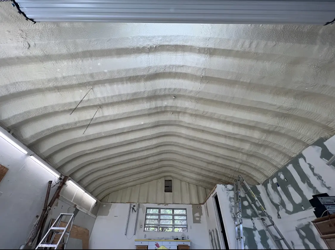 Spray polyurethane foam applied to the underside of a metal roof deck in Zebulon